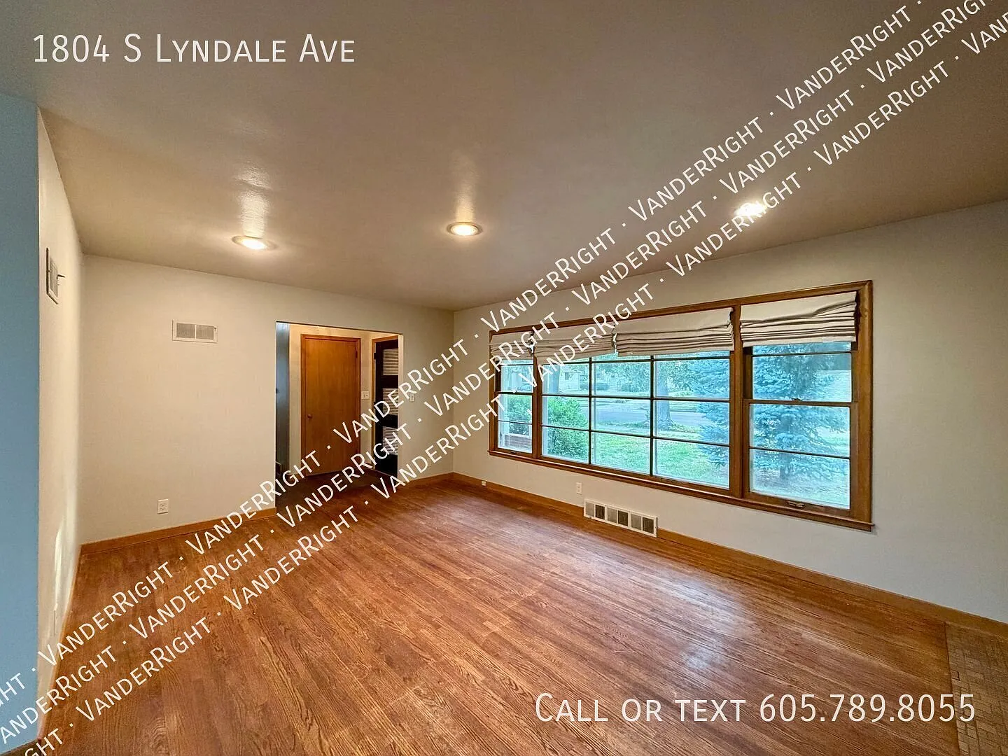 Charming 3-Bedroom Home with Hardwood Floors, Fenced Yard & Garage — Photo 2