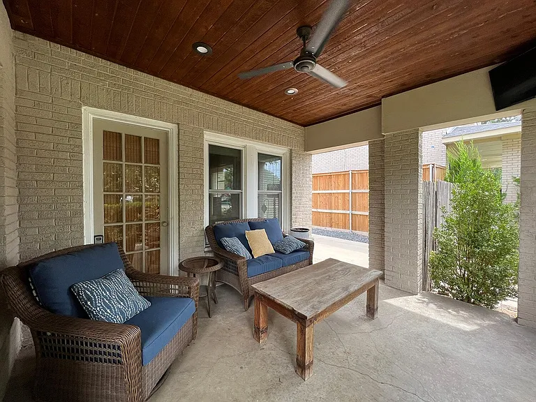 Front veranda with fan, dimmable lighting, and TV