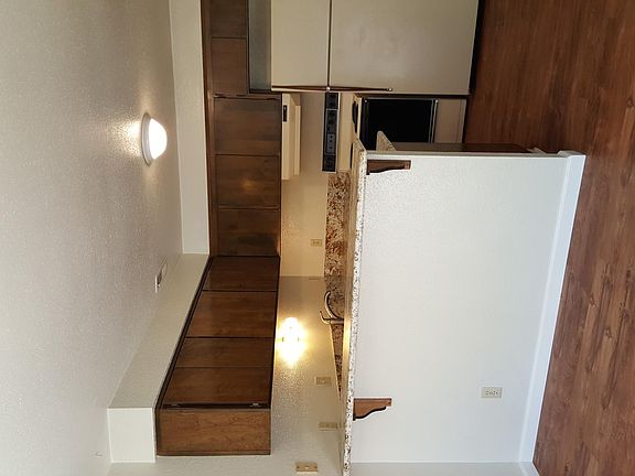 Kitchen with Granite Counters, breakfast bar, fridge