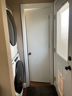 Laundry area, door to bathroom and door to back yard