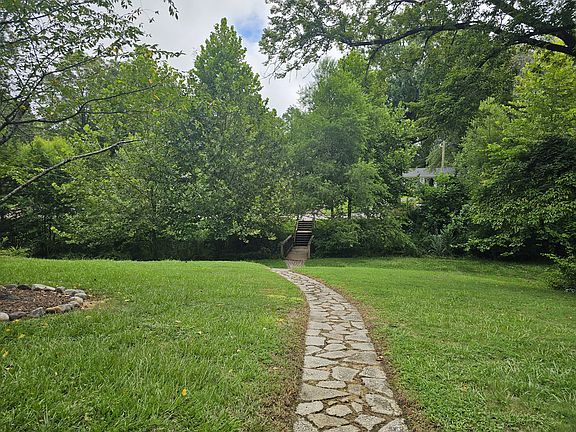 Back yard with walkway to street