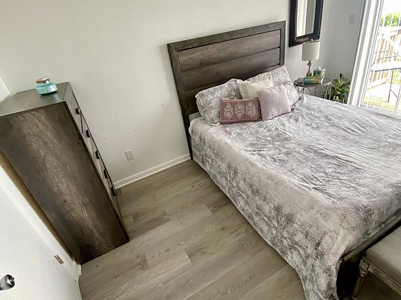 Bedroom w/balcony. open closet concept. recessed lighting. ceiling fan w/remote.
