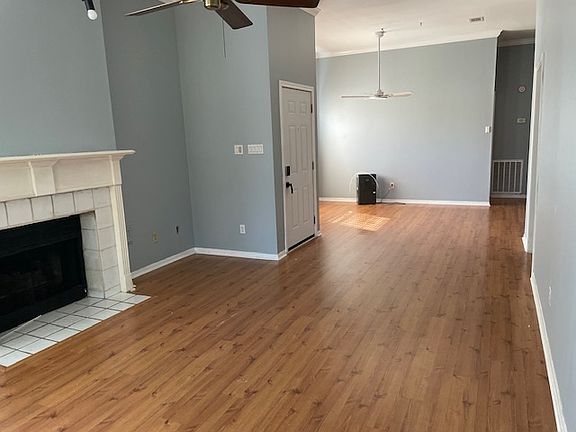 Living room and dining room with fireplace