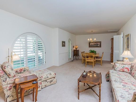 Formal living and dining. Notice the beautiful plantation shutters!