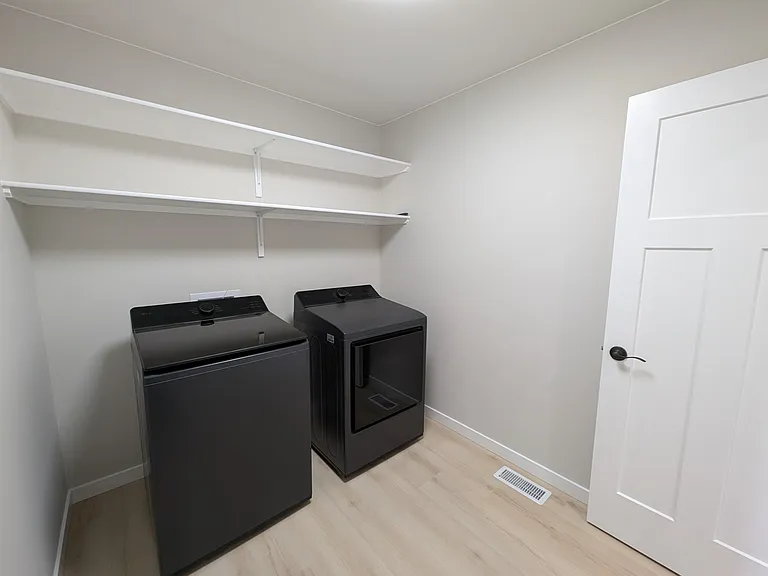 Laundry Room, with included Washer and Dryer.