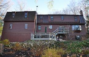 Rear of home with deck & patio