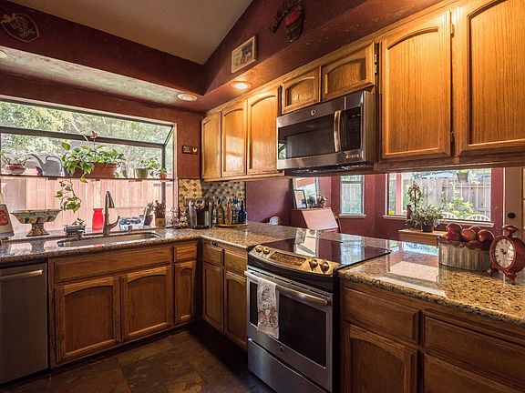 Stainless appliances (approximately 2 years old) in recently remodeled kitchen, fridge stays with house upon sell. Granite count