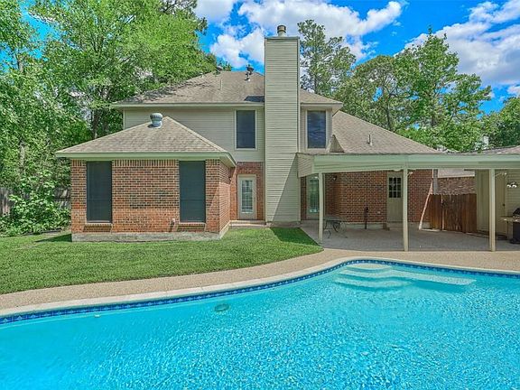 Pool and back exterior of house.