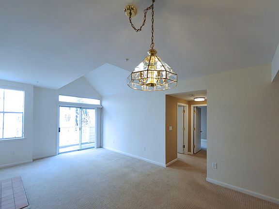Penthouse living room space with high ceiling 