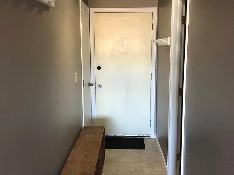 Entry hallway with shoe bench and coat closet