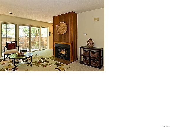 Natural light beams in this bright family room with fire place * All new windows