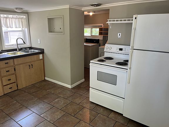kitchen and attached laundry room