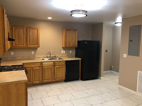 Kitchen and washer/dryer hookup area.