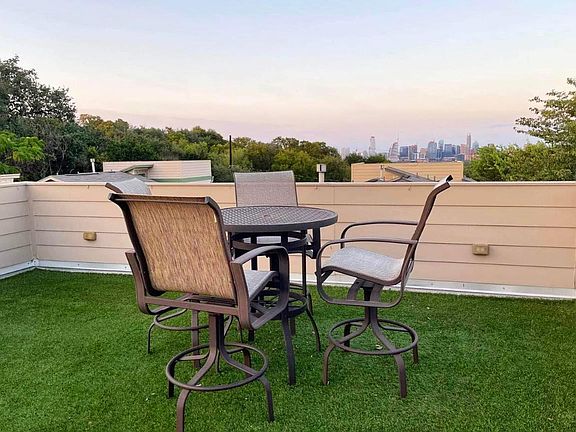 Spacious rooftop terrace with artificial turf