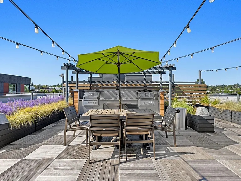 Gather friends around the dining table for a shared meal on the rooftop