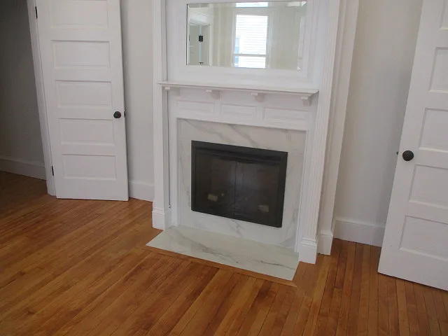 Electric fireplace in primary bedroom
