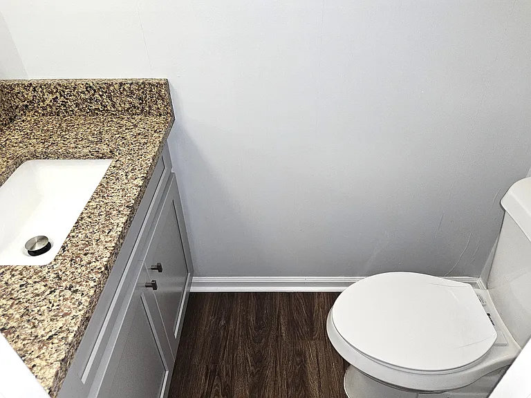 Downstairs Half Bath With New Vanity Cabinet