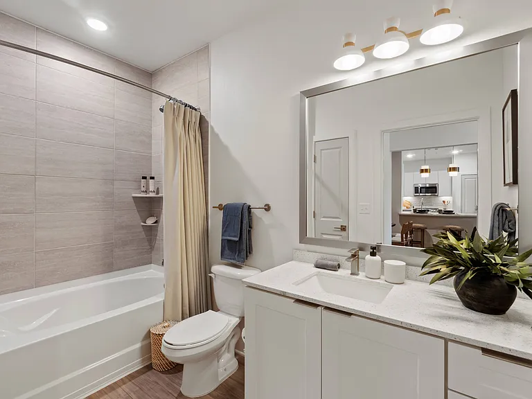 Bathroom with Quartz Countertop and Soaking Tub