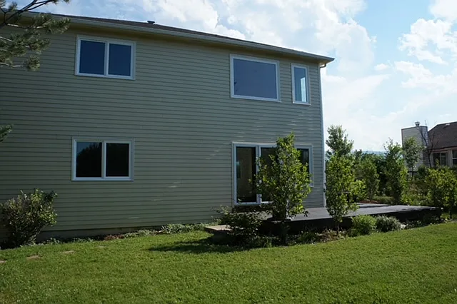 Sunny back yard with deck. Low maintenance landlord provides lawncare