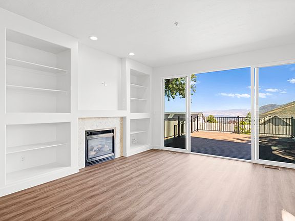 Living room with double patio door that opens onto deck
