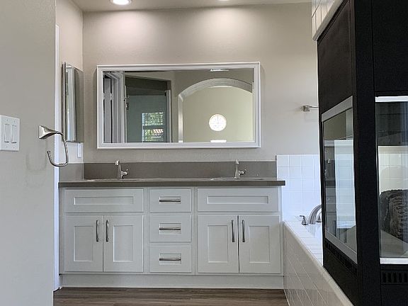 Master bathroom with soak-in tub, firepalce and stand up shower