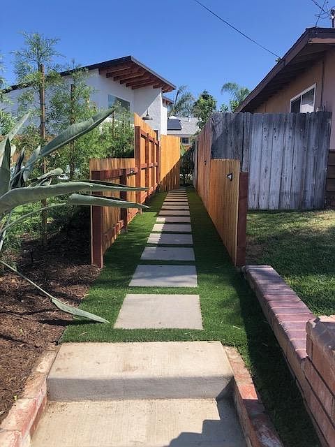 Private fenced entry to the property from the street