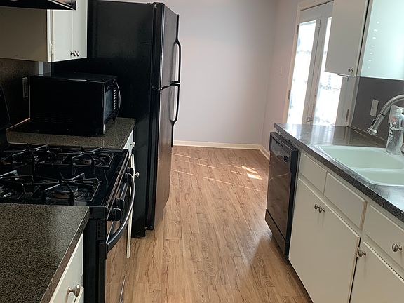 Kitchen, adjacent to living room area