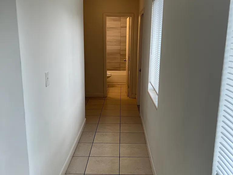 Hallway to bathroom and bedrooms