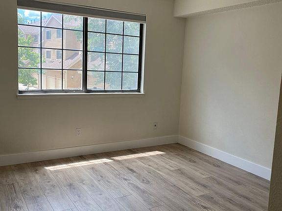 Primary bedroom with south facing window, blackout shade, and full size closet