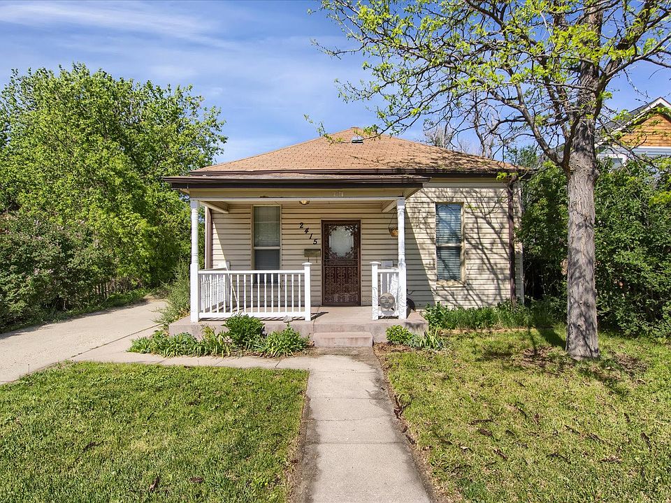 front of the house with porch and front yard