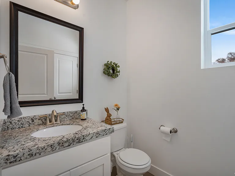 Main level half bathroom.