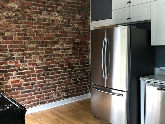 Exposed brick wall in Kitchen.