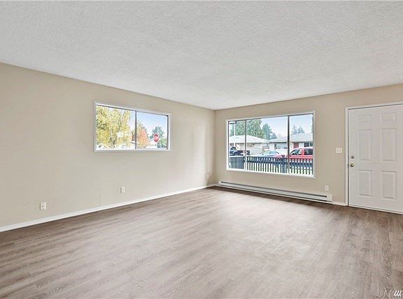 Large living room! New floors, paint, heaters.