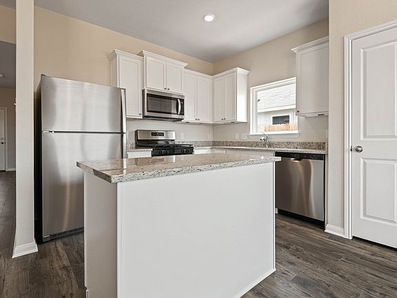 This home includes a chef-ready kitchen with granite counters, stainless appliances!