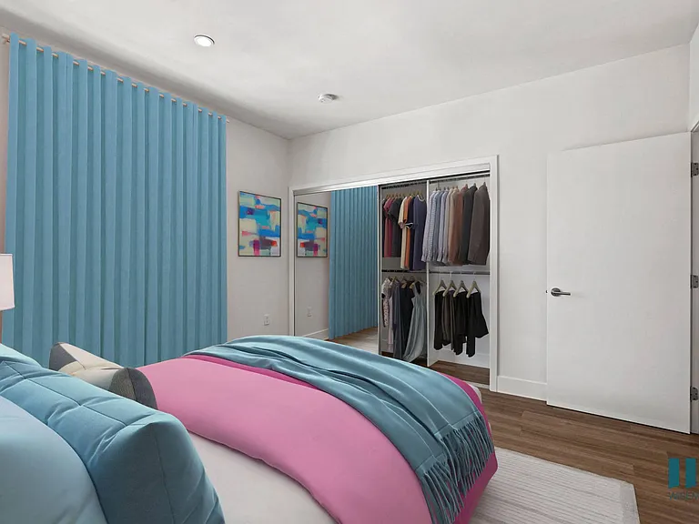 Bedroom with Vinly Flooring, Recessed Lighting, and Mirrored Closet