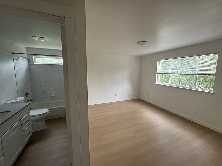Bright primary suite with direct access to the ensuite bathroom and a spacious, inviting layout.
