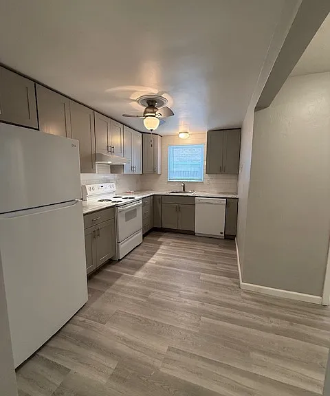 Kitchen equipped with refridgerator, freezer, oven, stop top, range hood, dishwasher, and lots of cabinet space!