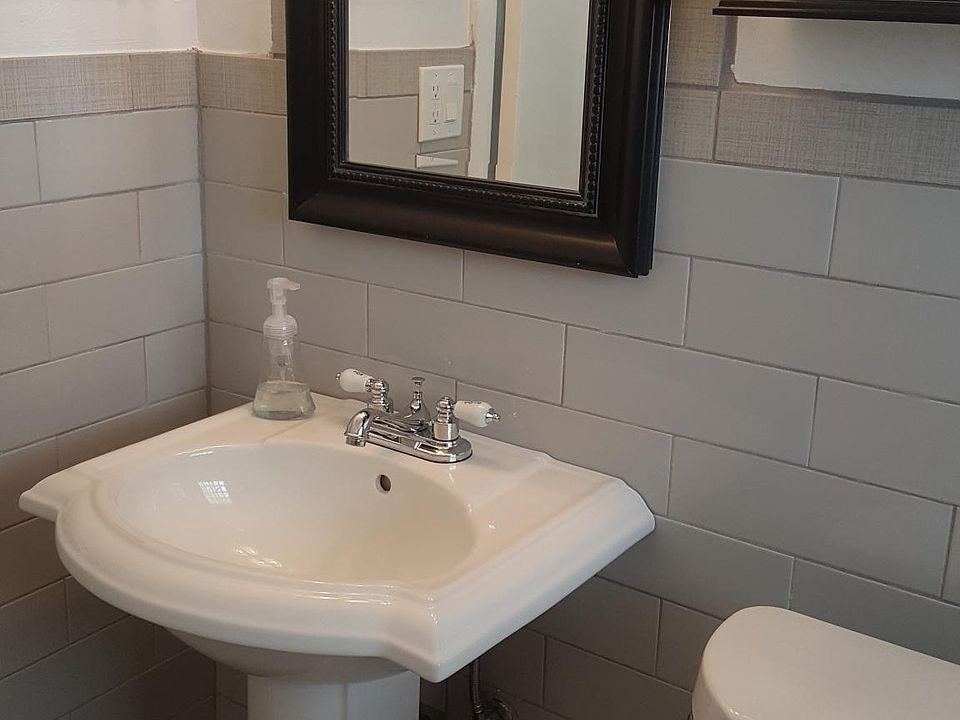 bathroom with bathtub and shower