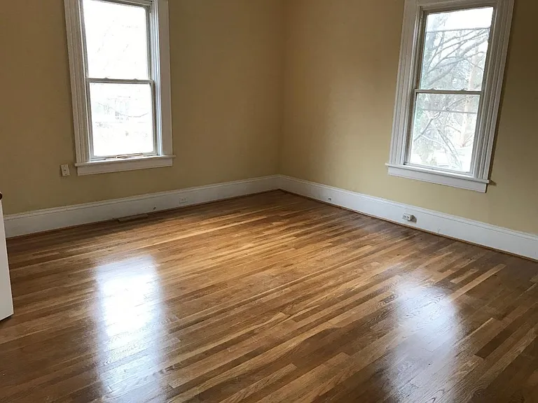 Upstairs bedroom, Southwest side. Floors refinished. High ceilings. 2 upstairs rooms, bath, with lock from downstairs if desired.