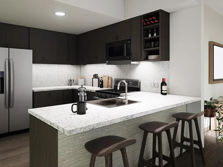 Light, bright and spacious kitchen with granite countertops, gourmet stainless steel appliances, and a breakfast bar