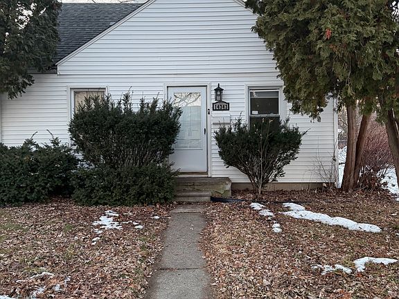 Front of house with sidewalk and mailbox on right side of entry door