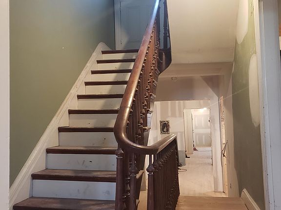 Stairs 2nd to 3rd floor. Can see towards dining room and kitchen