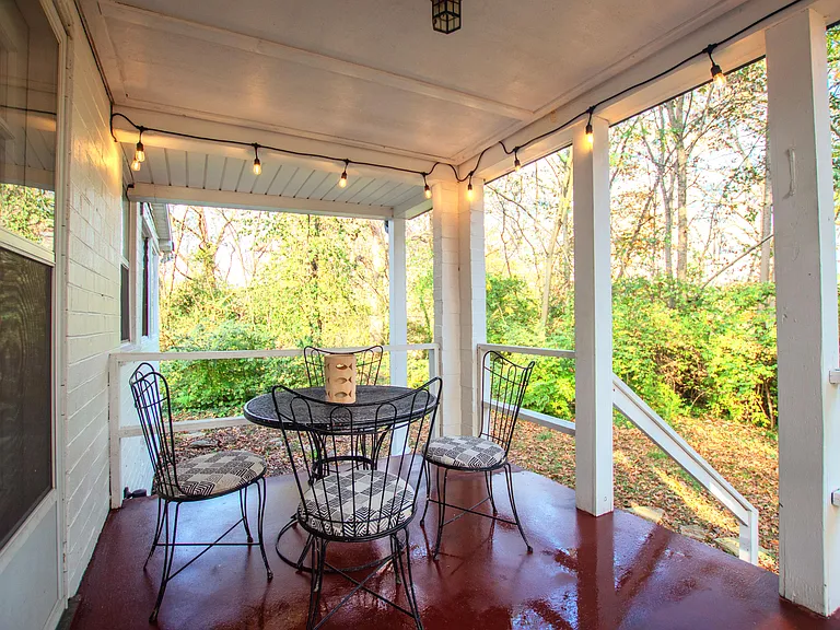 The covered side porch is a lovely place to enjoy your morning coffee or evening glass of wine.