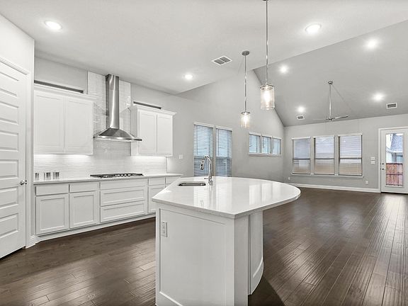 REPRESENTATIVE PHOTO - Kitchen in the Waldorf home plan by Trophy Signature Homes