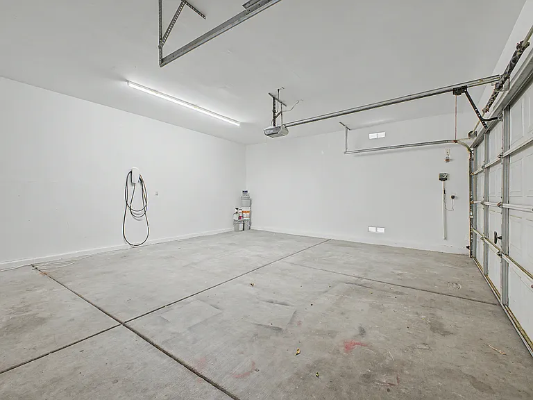 2 1/2 large sized garage with Tesla charger