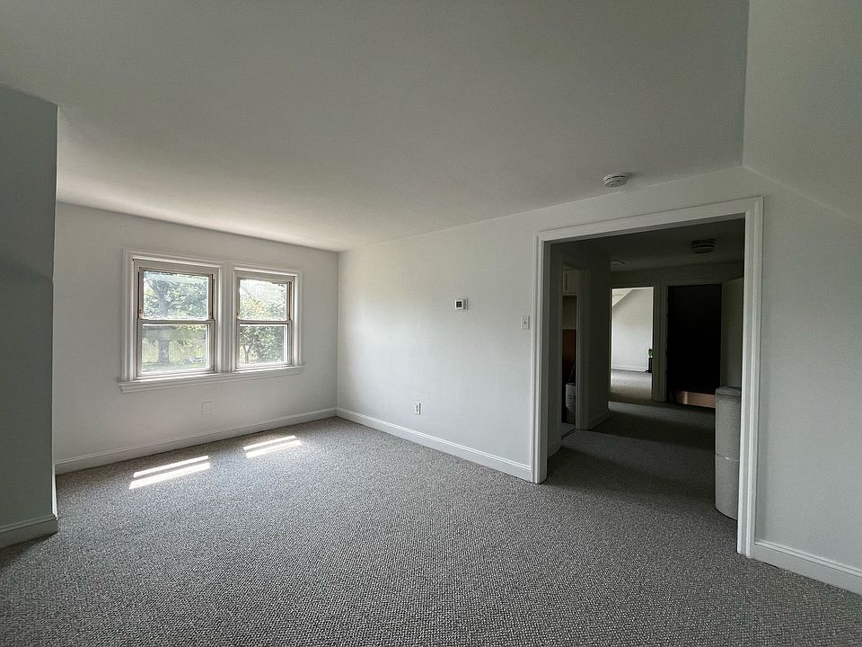 living room with beautiful views of backyard and plenty of sun, includes powerful AC unit (not pictured) that can cool entire apartment