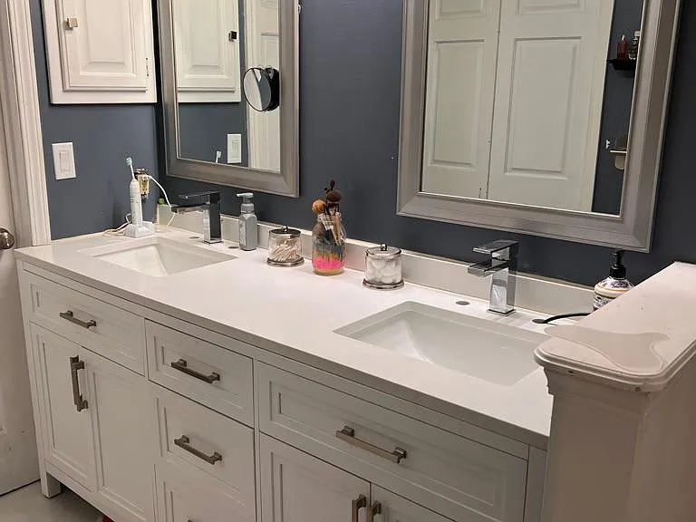 Master bath with a walk in closet
