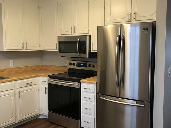 New stainless steel appliances along with dishwasher.