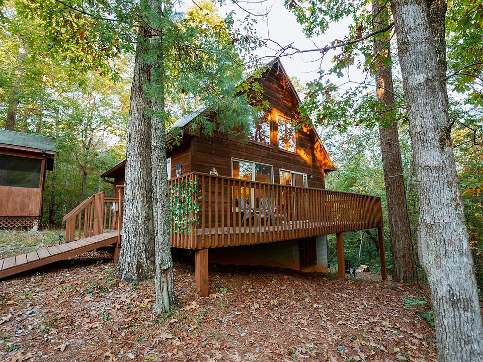 Beautiful cabin nestled in 1.6 acres of pine trees.