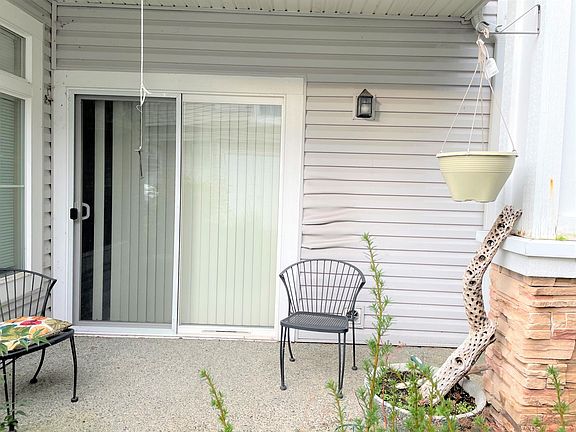 Private patio with space for small seating/dining area and grill.
